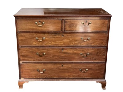 Lot 512 - A late George III mahogany chest.
