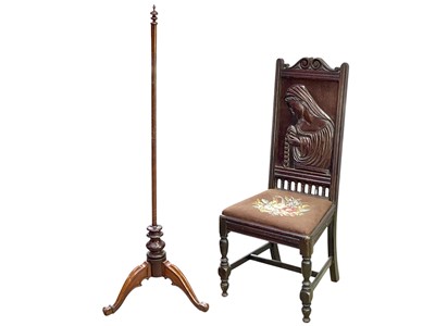 Lot 470 - A carved oak hall chair.