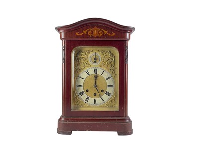 Lot 379 - A German mahogany cased triple train mantel clock.