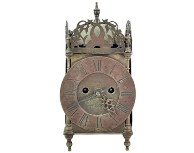 Lot 373 - A Victorian brass lantern clock.