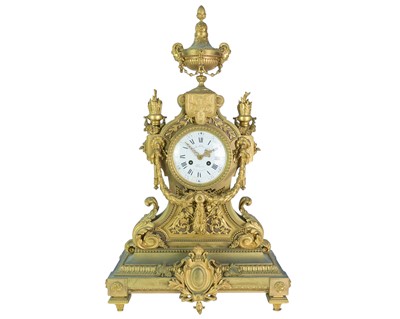 Lot 381 - An ornate French ormolu mantel clock.