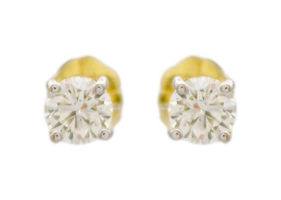 Lot 171 - A pair of 18k round brilliant-cut diamond solitaire ear studs.
