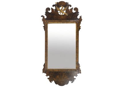Lot 314 - A George I style walnut fretwork wall mirror.