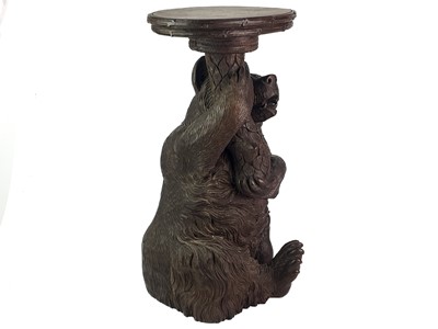Lot 1 - A Black Forest Linden wood carved bear stand.