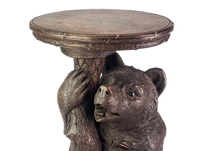 Lot 1 - A Black Forest Linden wood carved bear stand.