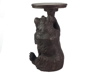 Lot 1 - A Black Forest Linden wood carved bear stand.