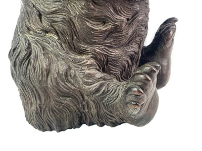Lot 1 - A Black Forest Linden wood carved bear stand.