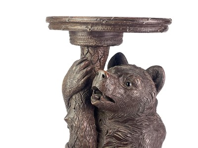 Lot 1 - A Black Forest Linden wood carved bear stand.