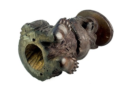 Lot 1 - A Black Forest Linden wood carved bear stand.