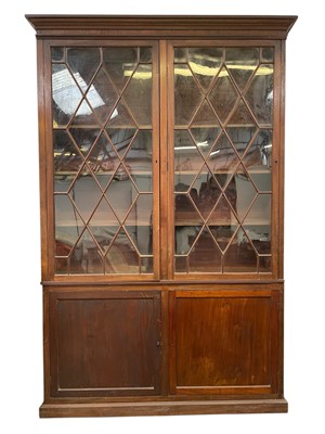 Lot 471 - A mahogany bookcase cabinet.