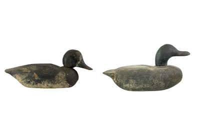 Lot 307 - An American carved pine duck decoy.
