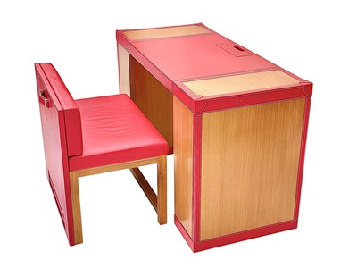 Lot 430 - Superyacht furnishings, a red leather space-saving desk with a matching upholstered chair.