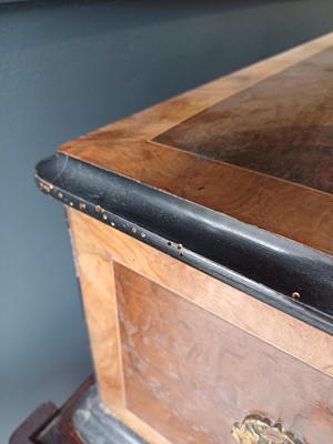 Lot 50 - A Nicole Freres figured walnut and banded cylinder music box on a stand.