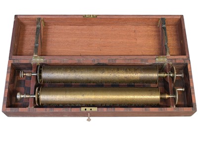 Lot 50 - A Nicole Freres figured walnut and banded cylinder music box on a stand.