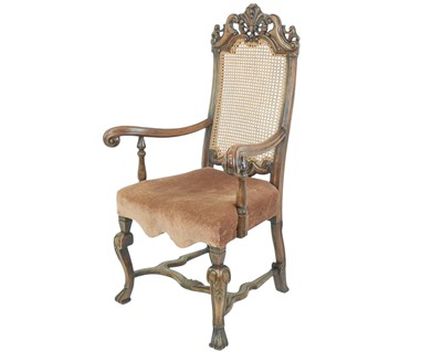Lot 491 - A Carolean style walnut framed elbow chair.