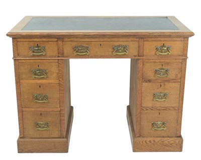 Lot 456 - A late Victorian oak twin pedestal desk.