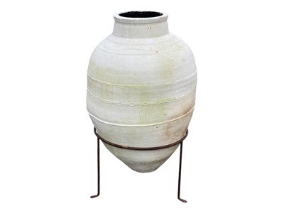 Lot 359 - An olive jar on a stand.