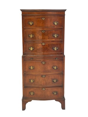 Lot 521 - A mahogany dwarf serpentine front two part chest on chest.