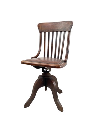 Lot 443 - An Edwardian oak office or typist's chair.