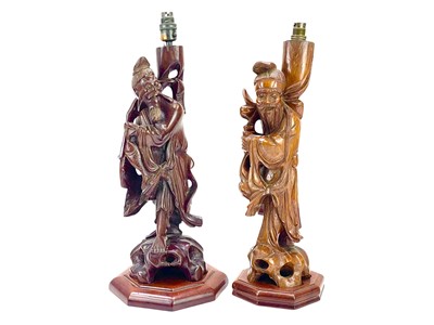 Lot 301 - Two Chinese carved hardwood figural lamp bases.