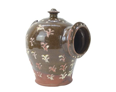 Lot 255 - A 19th century English slipware decorated salt pig.