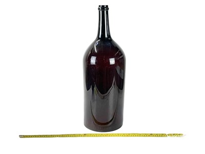 Lot 58 - A monumental blown brown glass bottle, Balthazar?