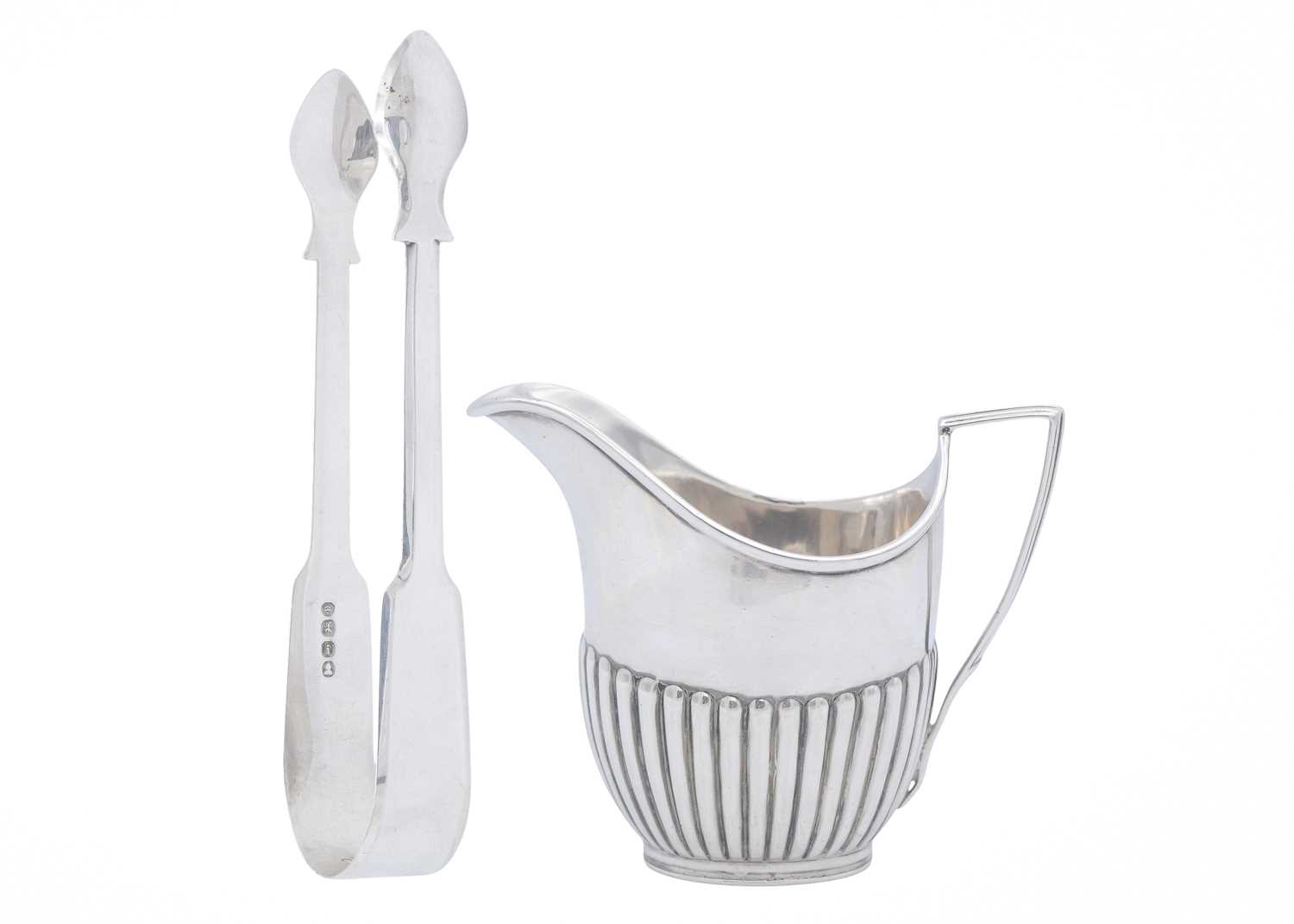 Lot 19 - An Edwardian silver cream jug, and a pair of George IV sugar tongs.
