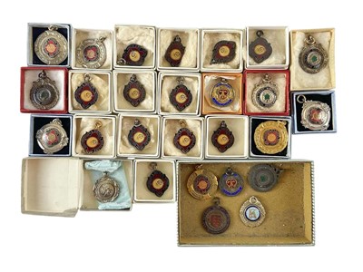 Lot 551 - A collection of enamel cycling fobs.