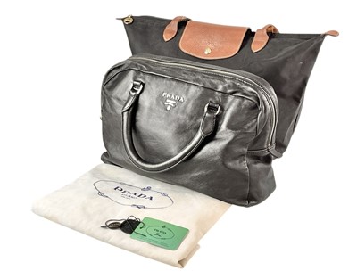 Lot 261 - PRADA - A Vela Nero B8888 black leather handbag.