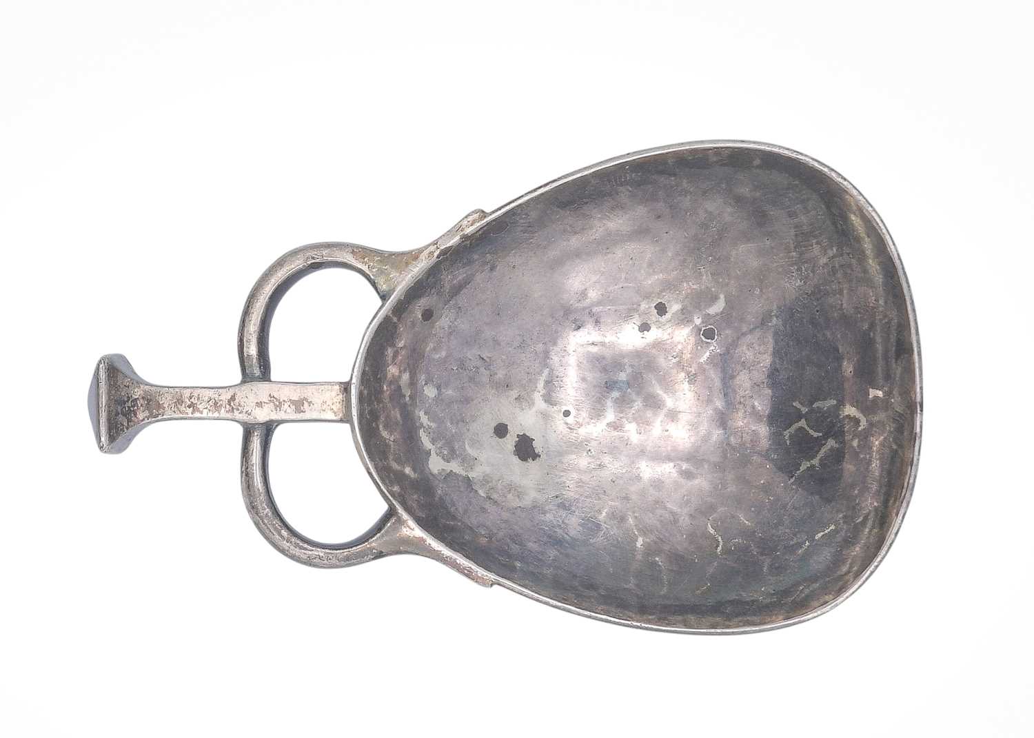 Lot 22 - An Edwardian Art & Crafts silver caddy spoon by Albert Edward Jones.