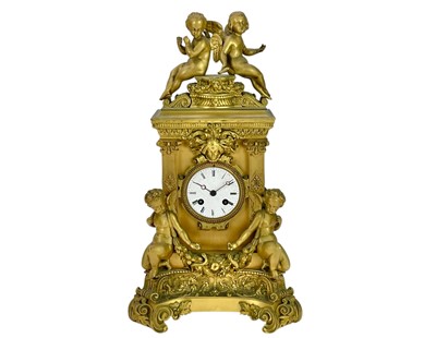 Lot 466 - An ornate French ormolu mantel clock.