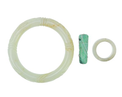 Lot 691 - Jadeite bangle, ring and brooch.