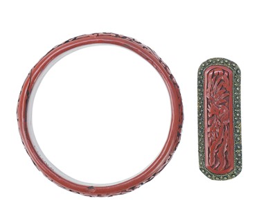 Lot 679 - A cinnabar lacquer bangle and brooch.