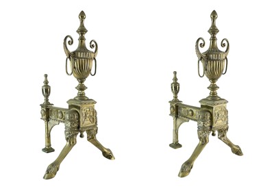 Lot 70 - A pair of ornate Neo-classical brass andirons.
