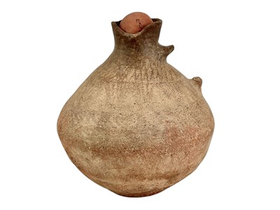 Lot 244 - An ancient clay vessel.