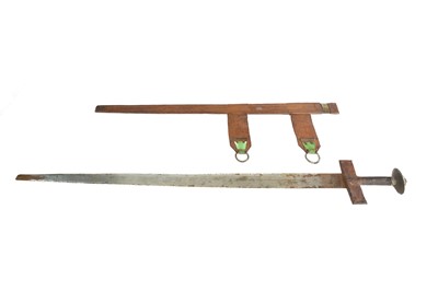 Lot 592 - An African Tuareg sword in leather scabbard.