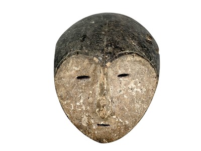 Lot 107 - A carved wood African mask.