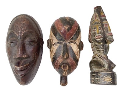 Lot 115 - Two carved hardwood African masks.