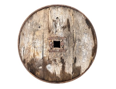 Lot 31 - A Middle Eastern oak and wrought iron cartwheel.