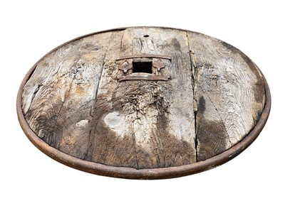 Lot 31 - A Middle Eastern oak and wrought iron cartwheel.