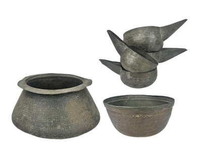 Lot 109 - A set of four spouted copper water bowls.