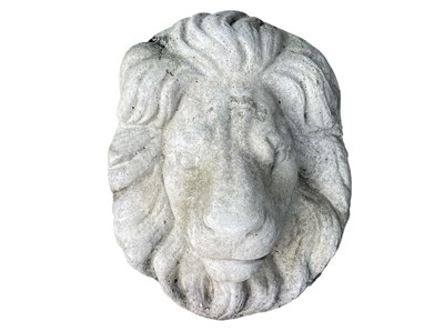 Lot 391 - A reconstituted stone lion wall mask.