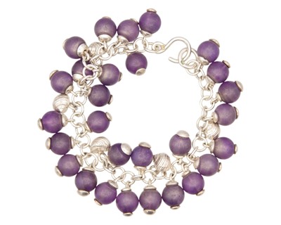 Lot 76 - FAY PAGE, ISLES OF SCILLY - A silver and amethyst bead set bracelet.