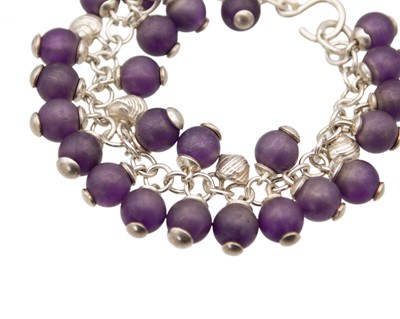 Lot 76 - FAY PAGE, ISLES OF SCILLY - A silver and amethyst bead set bracelet.