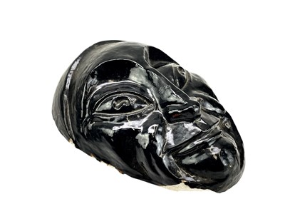 Lot 46 - A 20th century painted plaster wall mask.