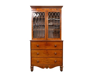 Lot 440 - A Regency mahogany and rosewood banded secretaire bookcase.
