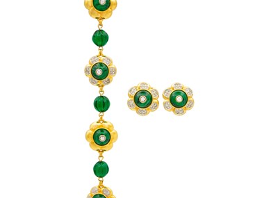 Lot 18 - A Swarovski gold-plated bracelet and a matching pair of ear clips.