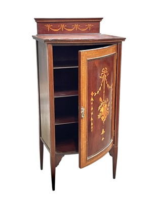 Lot 413 - An Edwardian mahogany and inlaid music cupboard.