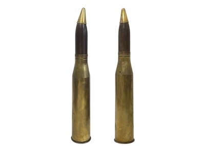 Lot 597 - A pair of 1948 inert 20-pounder brass shell cases and heads.