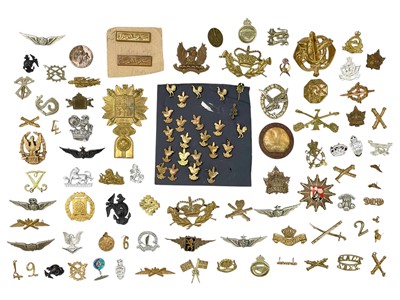 Lot 569 - A collection of assorted foreign cap badges.
